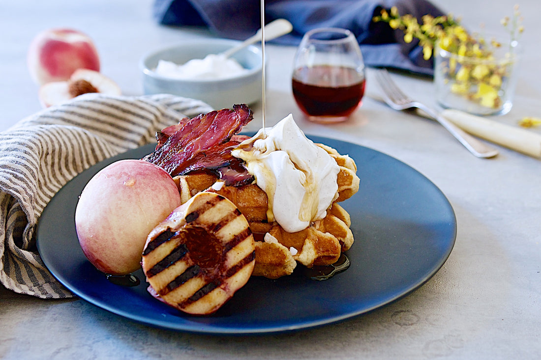 Belgian waffles with candied bacon, grilled stonefruit and maple yoghurt